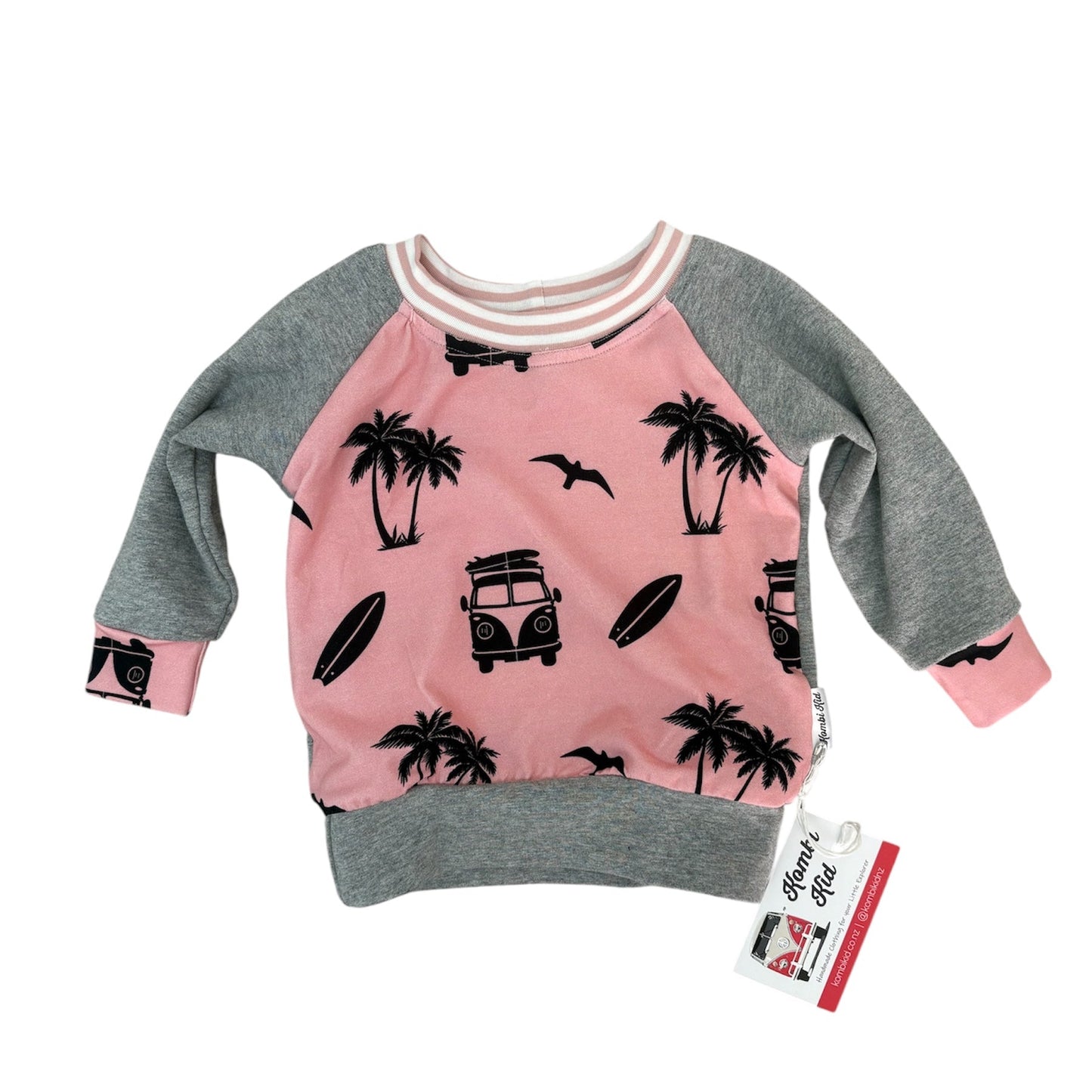 Pink and gray sweatshirt with palm tree and car design on a white background