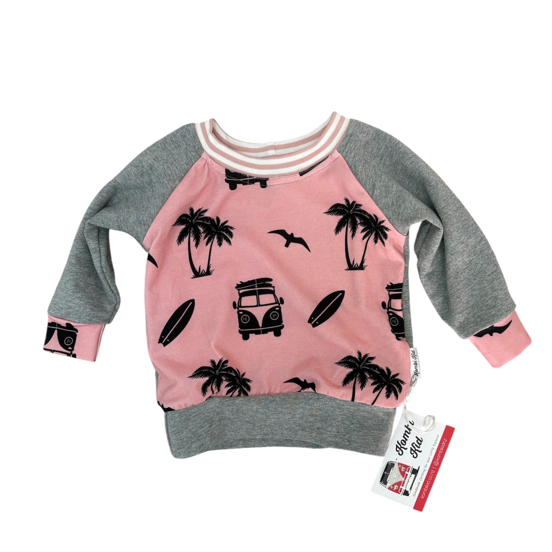 Pink and gray sweatshirt with palm tree and car design on a white background